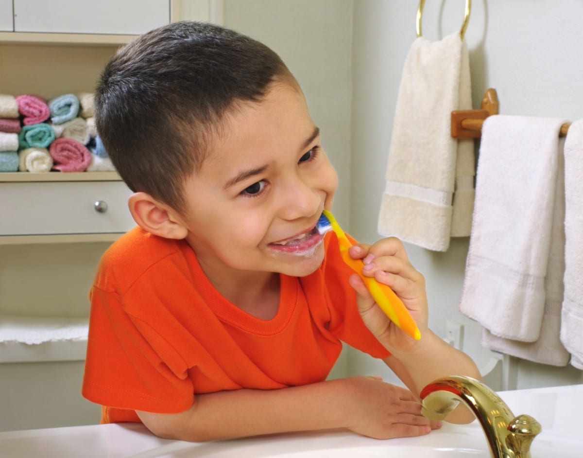 Child brushing teeth
