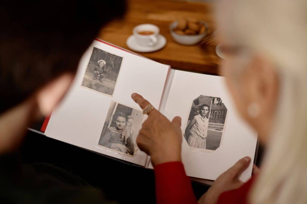 people looking at old photos